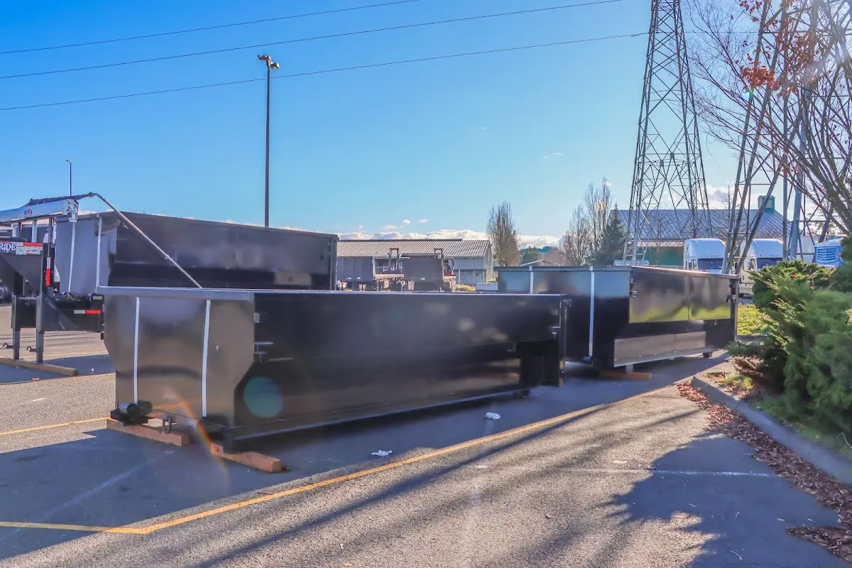 Roll-off dumpster ready for waste disposal at job site for 2 Yard Dumpster Rental in Commerce